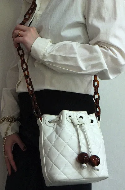 Authentic Chanel White Quilted Tortoise Hardware Drawstring Handbag