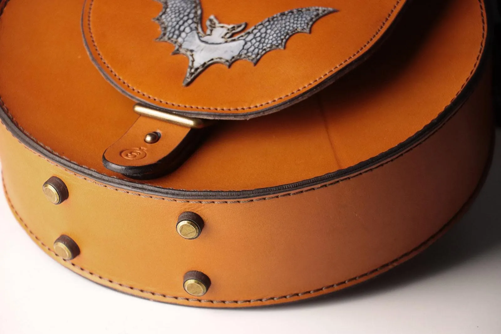 Sleek Cognac Bat Crossbody Handbag