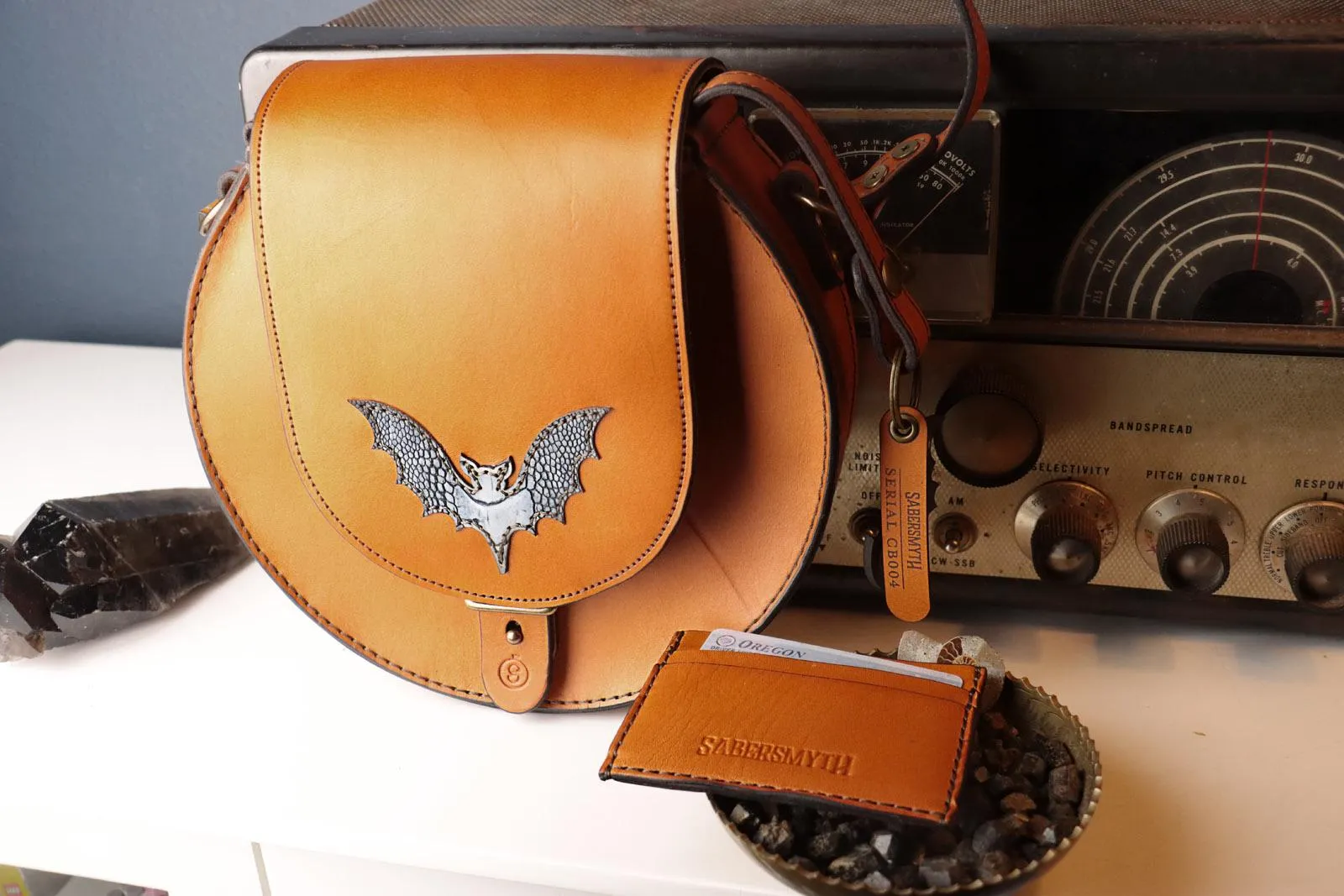 Sleek Cognac Bat Crossbody Handbag