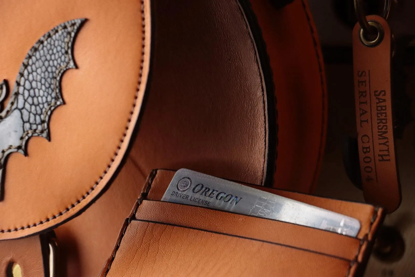 Sleek Cognac Bat Crossbody Handbag