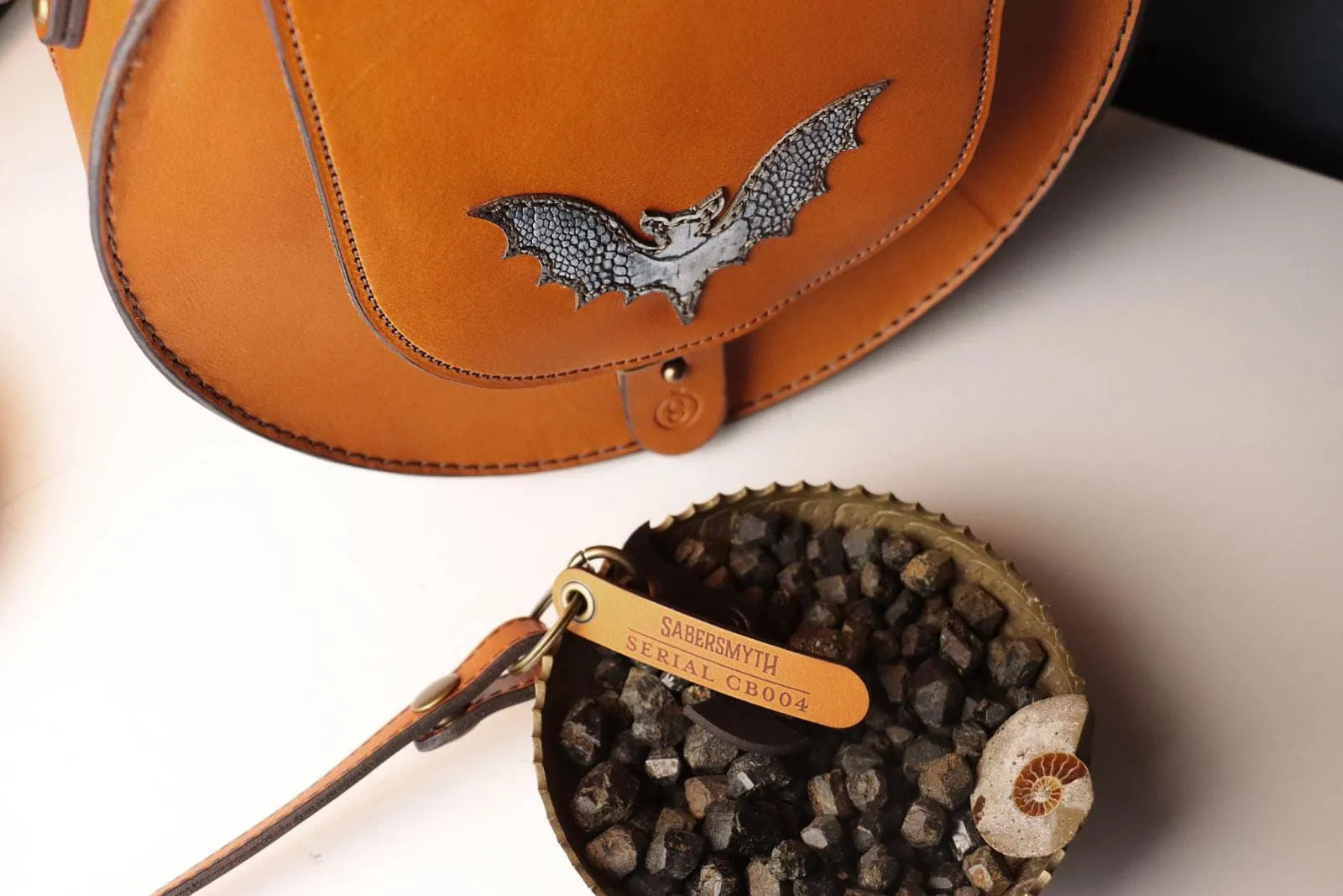 Sleek Cognac Bat Crossbody Handbag