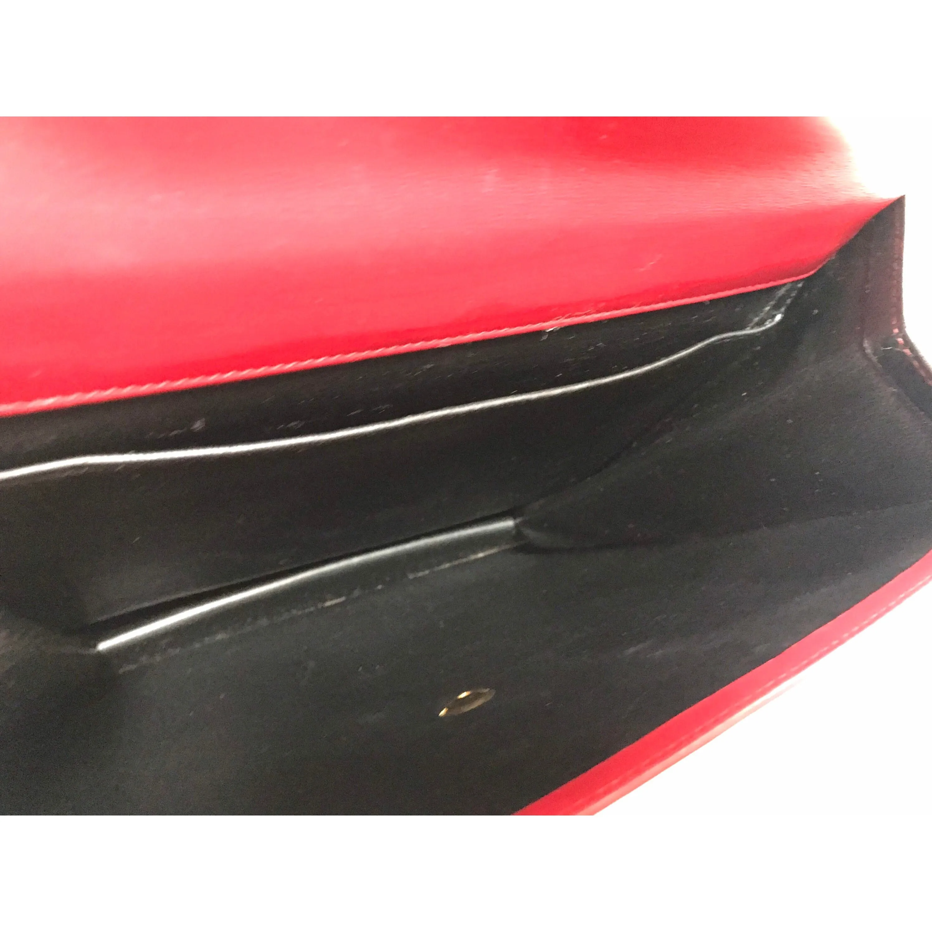 Vintage Karl Lagerfeld red and black double face shoulder bag with golden logo motifs. Rare unique bag. Must have.