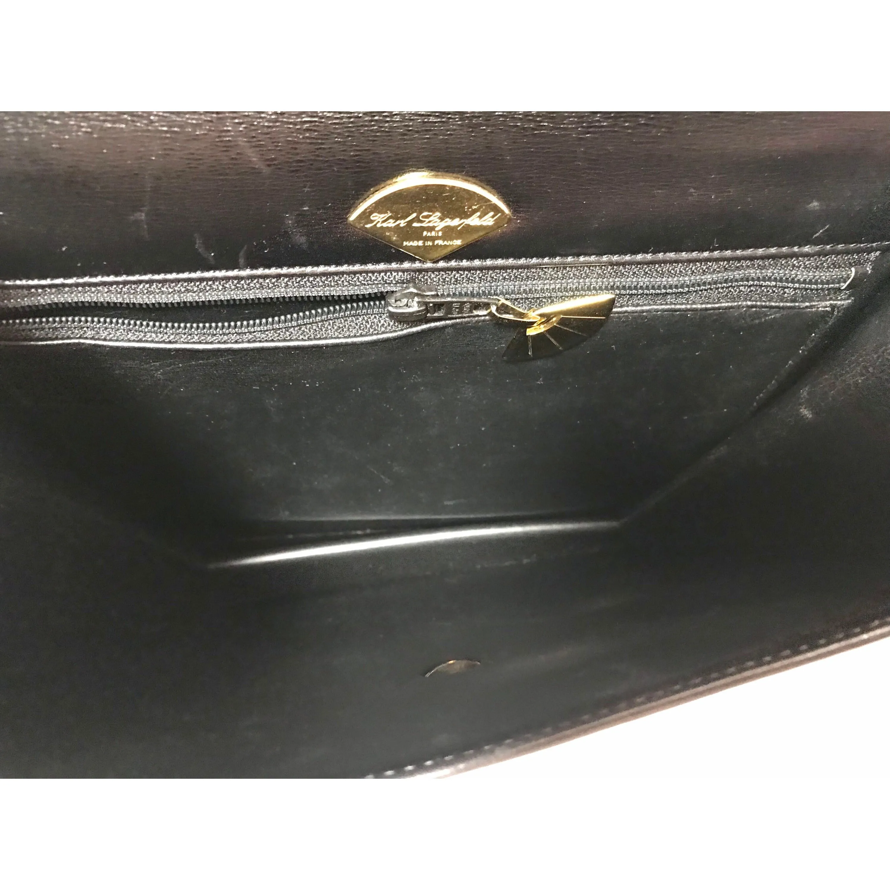 Vintage Karl Lagerfeld red and black double face shoulder bag with golden logo motifs. Rare unique bag. Must have.